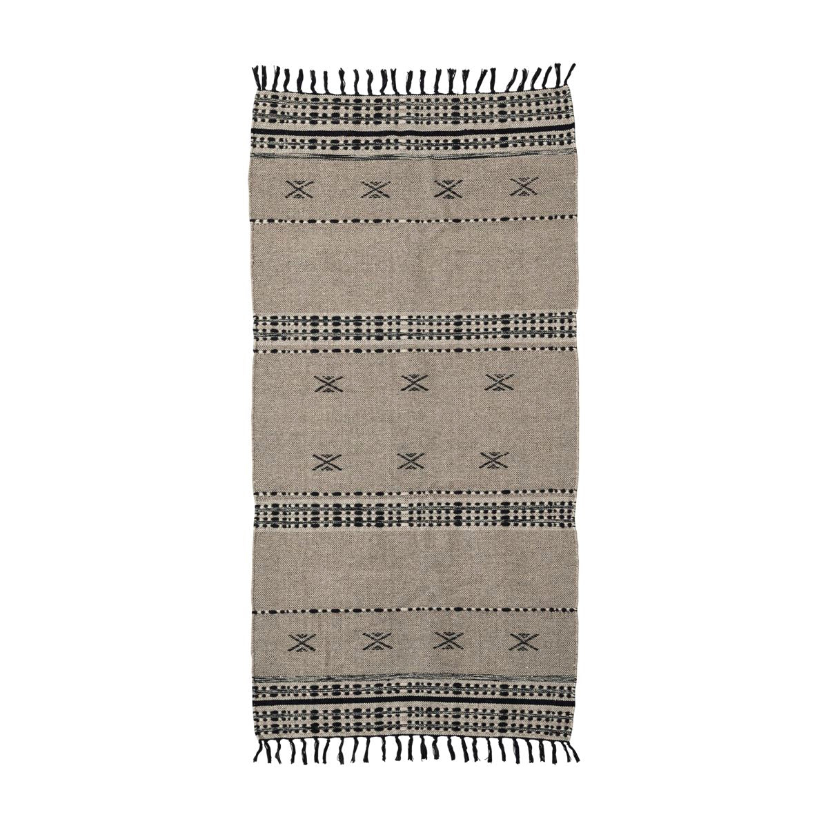 black & beige rug with tassels